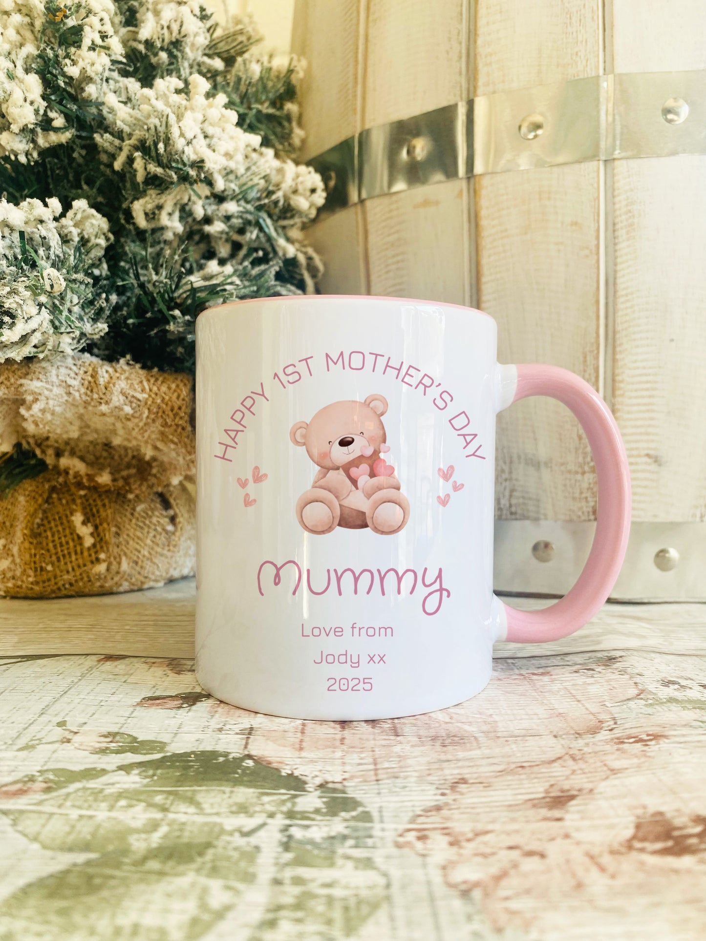 Personalised 'Happy 1st Motherโs Day' mug with pink handle, teddy bear and heart design, and custom name and year, gift for new mummy