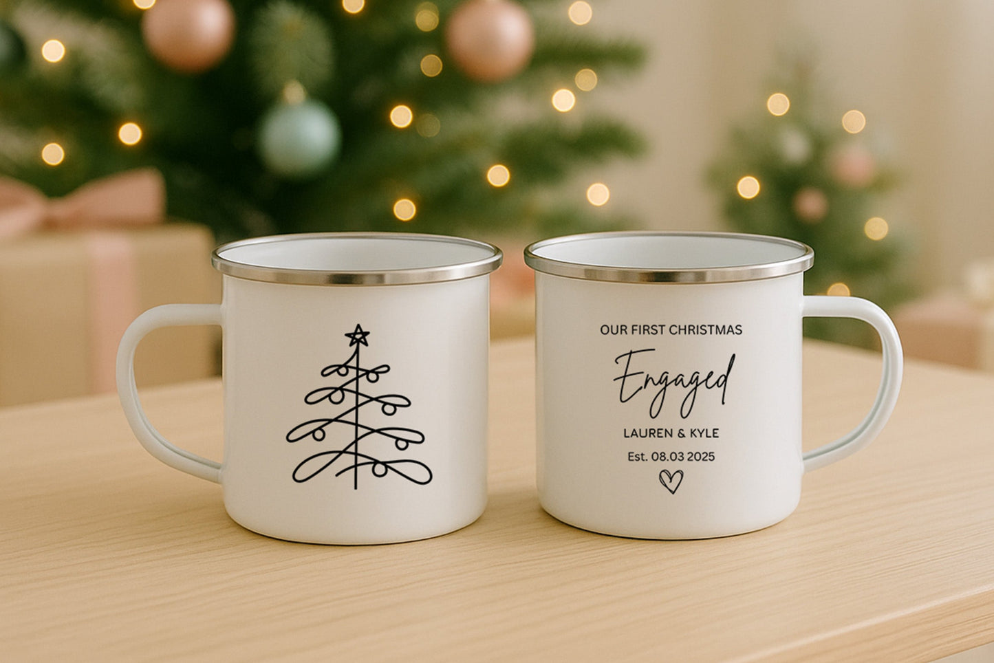 Two Personalised Enamel Mugs with a Christmas Tree on one side and 'Our First Christmas Engaged' on the other, along with names and date.