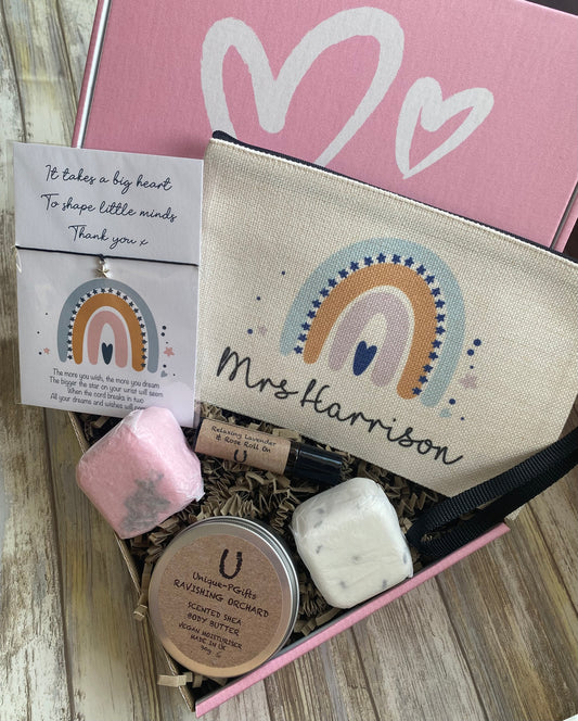 Personalised Teacher Hamper, Teacher Gift, pink gift box, fully open, showcasing the "Mrs Harrison" pouch, star charm bracelet, oil, bath melts, and body butter neatly arranged inside.