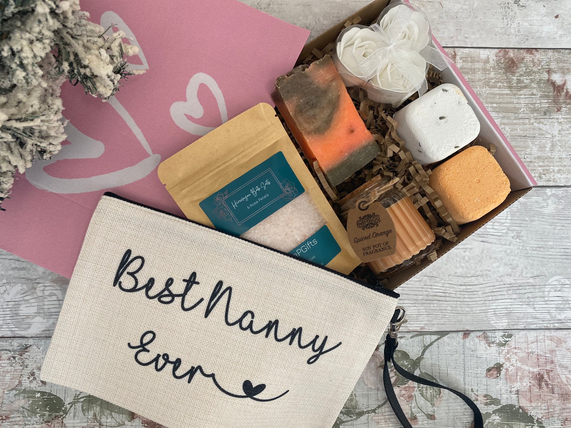 Best Nanny Ever pamper gift set with bath salts, handmade soap, bath bomb, soy wax candle, rose soap flowers, and canvas makeup bag — perfect Christmas or birthday gift for nanny.
