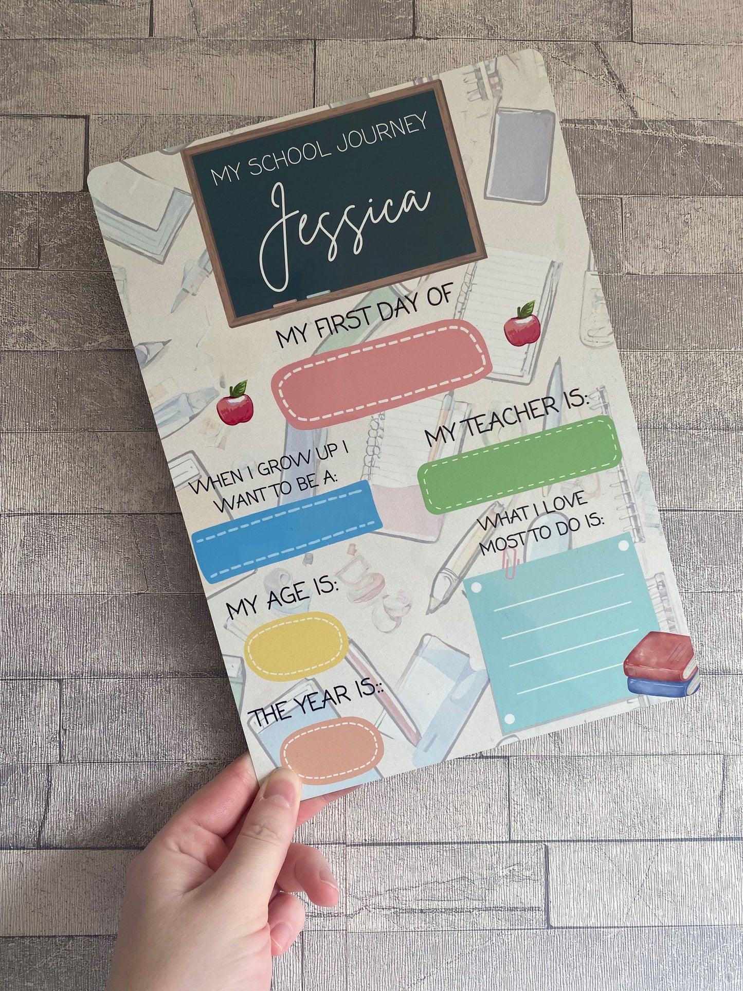 Personalised “My School Journey” dry-wipe board for kids featuring child’s name and sections to fill in: first day of school, teacher’s name, age, future aspiration, and favourite activities. Custom back-to-school memory keepsake for children, reusable design with colourful illustrations.