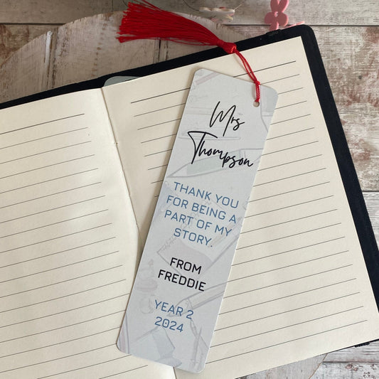 Personalised teacher bookmark for Miss Thompson – blue and grey design with red tassel, featuring thank you message from Freddie, Year 2, 2024.