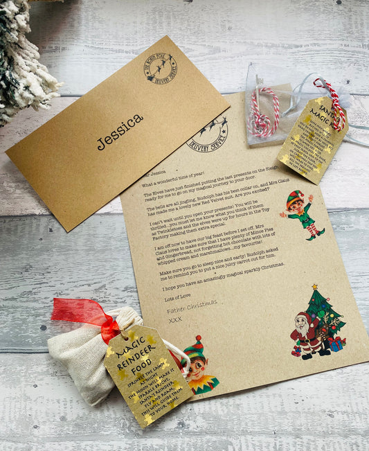 Personalised letter and gift set with Santa Claus illustration on a wooden surface