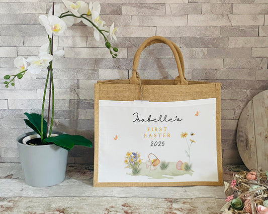 Natural jute tote bag with white panel, Easter-themed illustrations, and personalised 'First Easter 2025' text, perfect for children