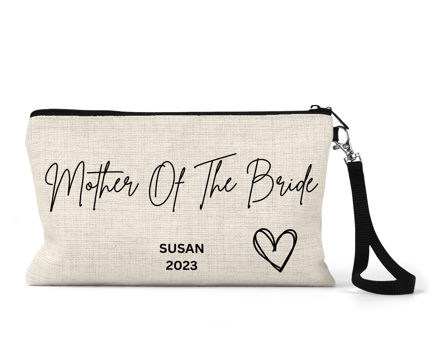A cream-colored canvas zippered clutch bag with black text that reads "Mother Of The Bride" in cursive, "Susan 2023" in bold, and a hand-drawn-style heart design. The bag has a black wrist strap attached with a metal clip.