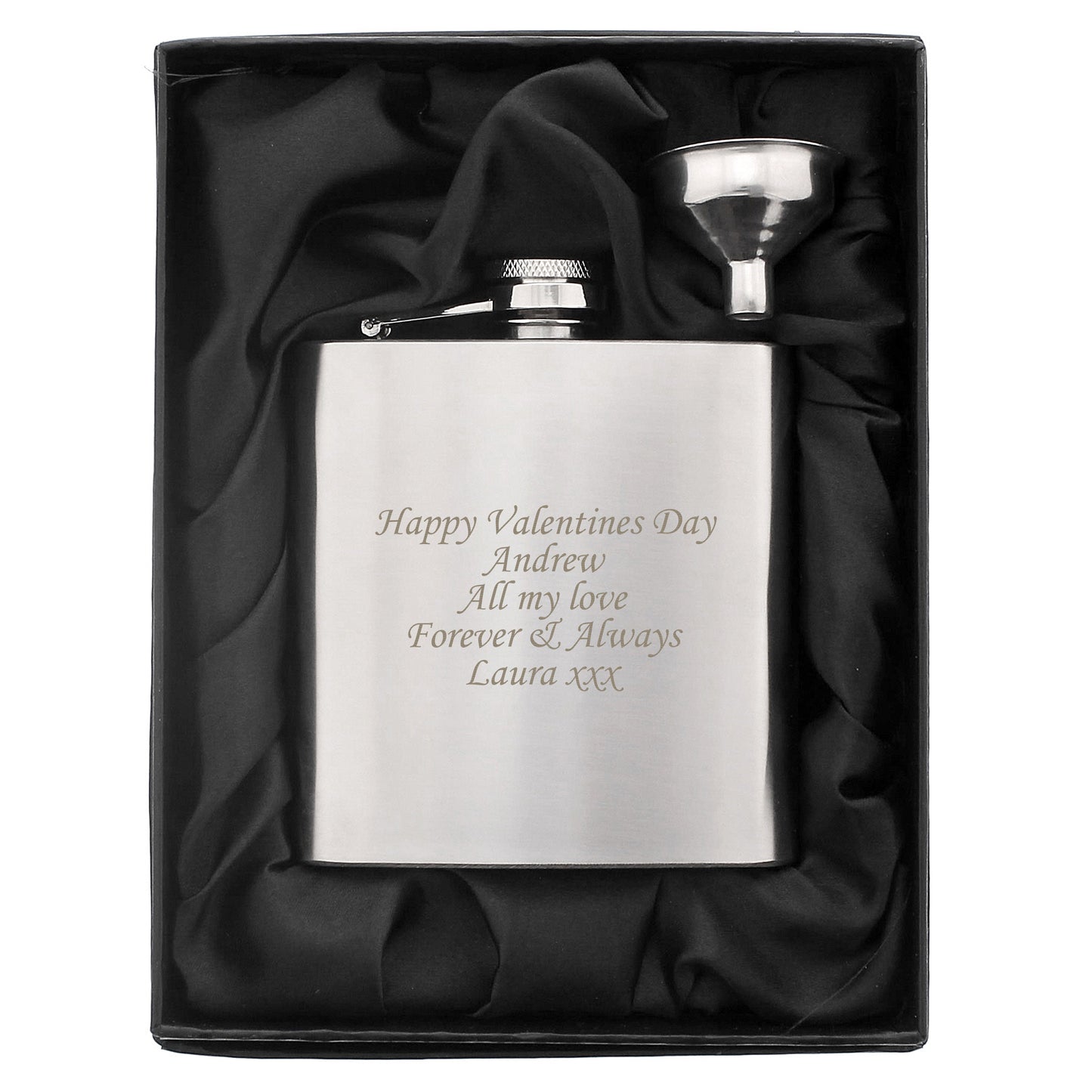 Silver hip flask with engraved message in a black satin-lined box