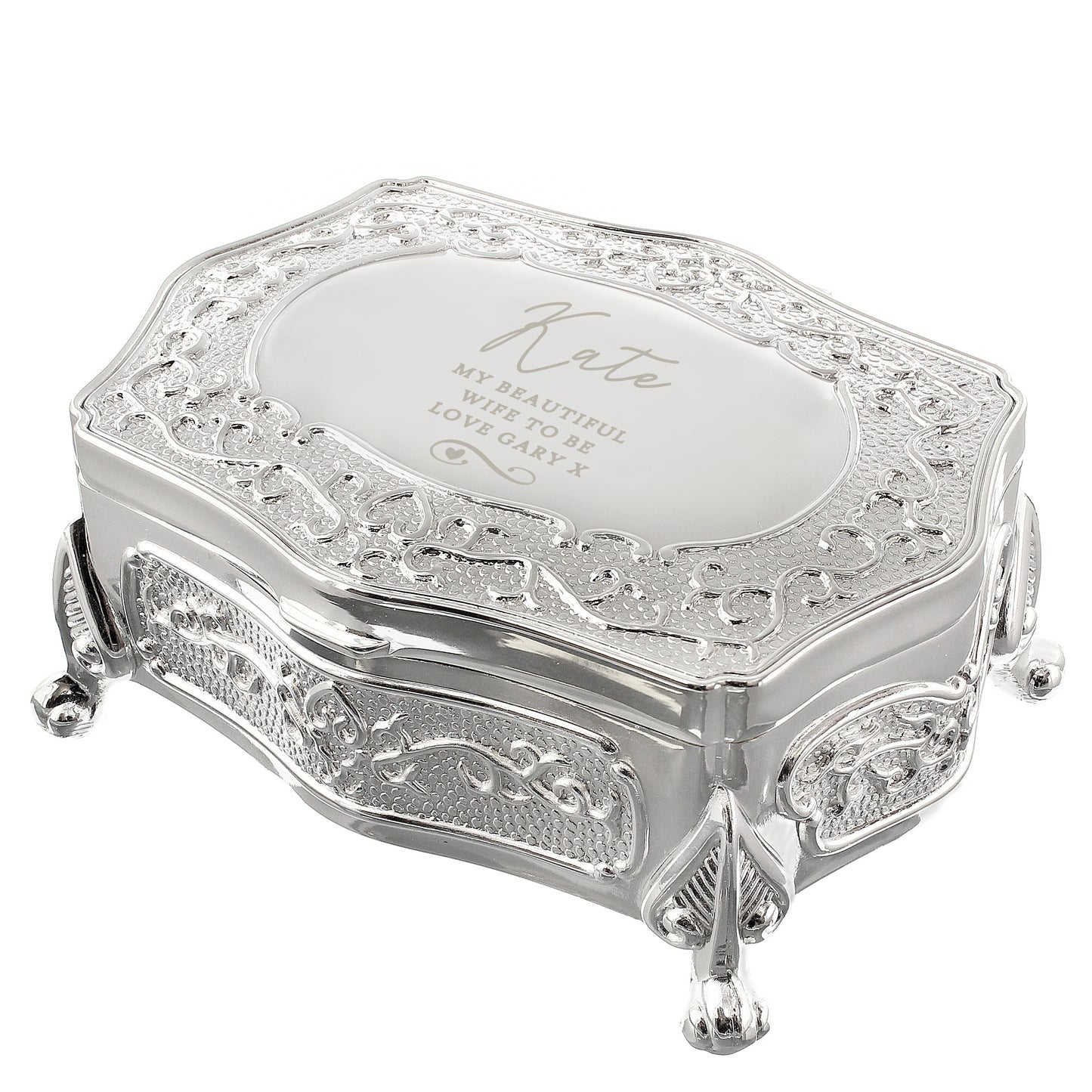 Decorative silver jewellery box with intricate designs on a white background