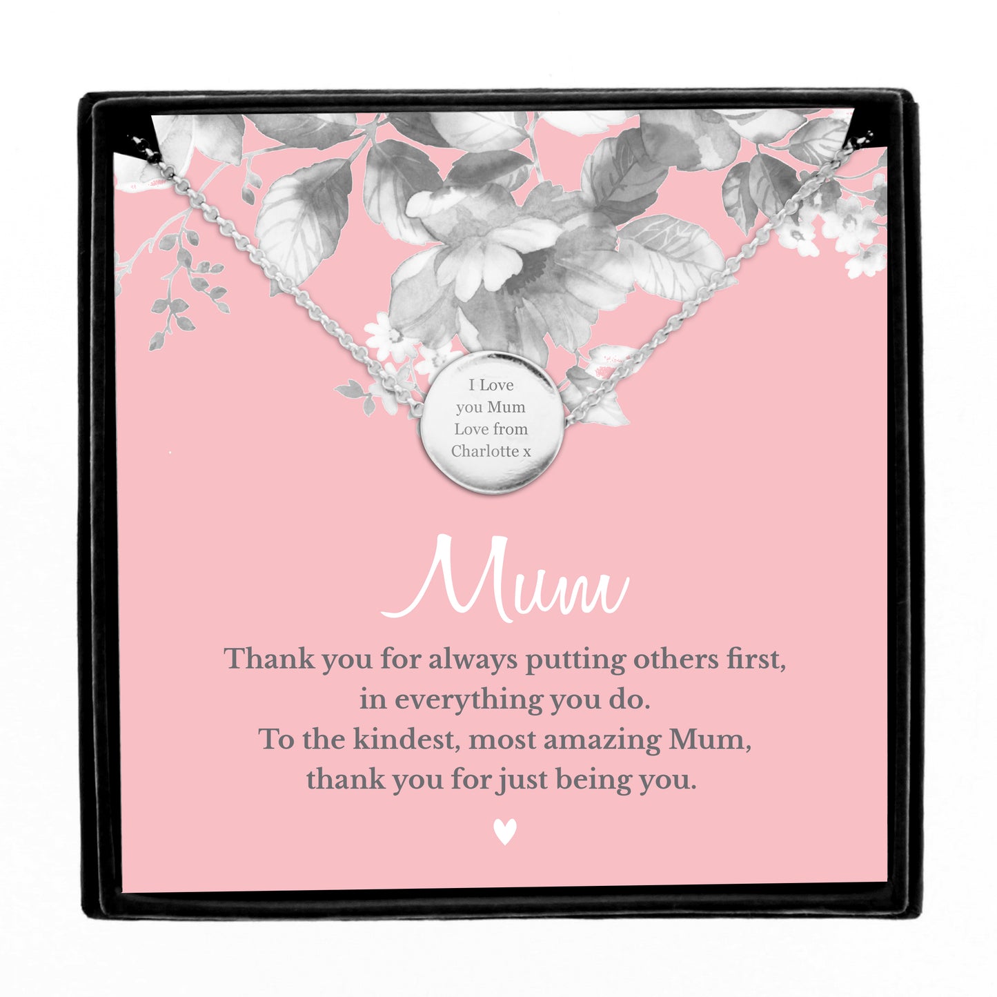 Necklace with a sentimental message card on a pink background