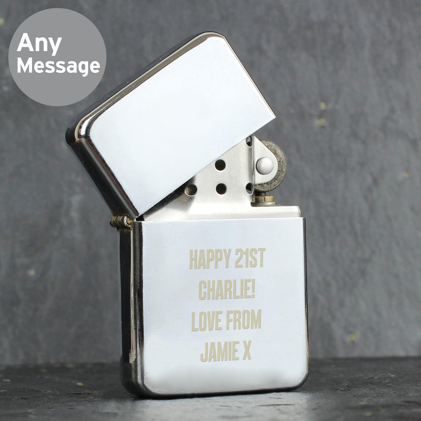 Personalised lighter with engraved text on a grey background