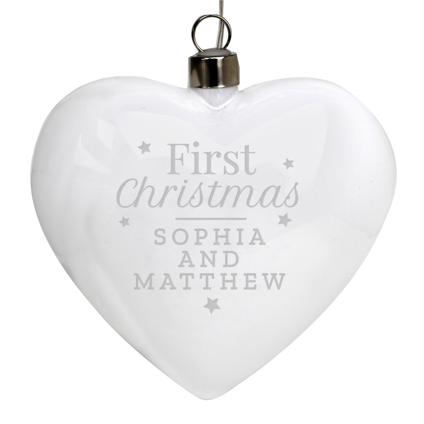 White heart-shaped ornament with 'First Christmas Sophia and Matthew' text on a white background