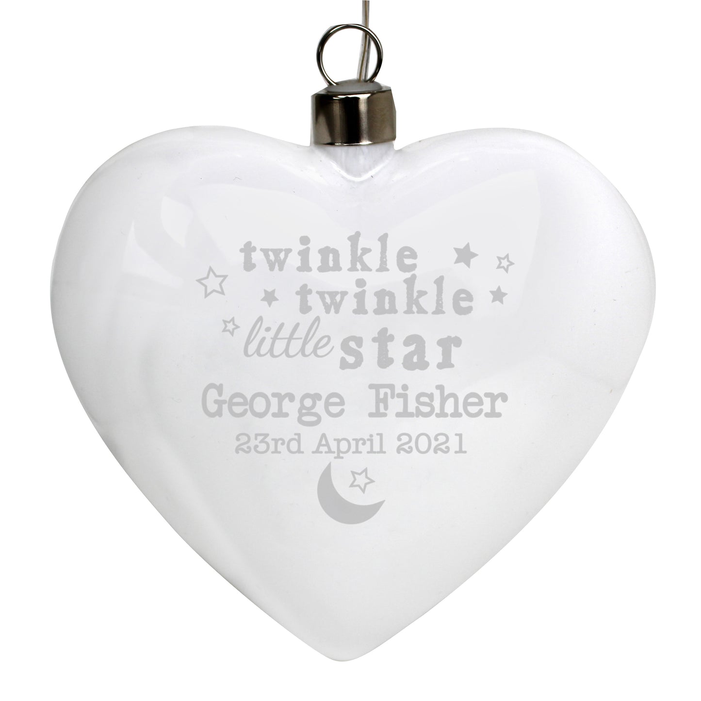 Heart-shaped ornament with engraved text on a white background