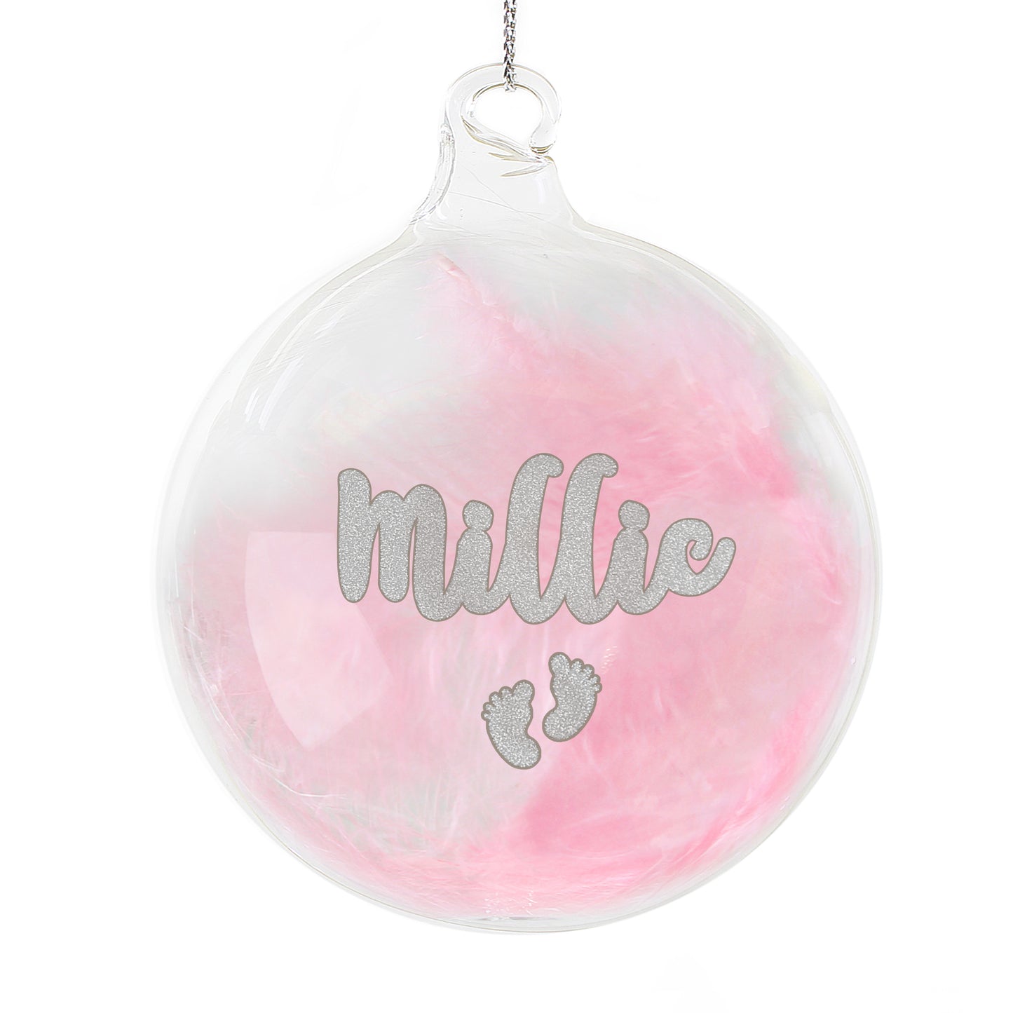 Personalised glass bauble filled with soft pink feathers, featuring the name “Millie” in sparkling silver glitter script above a pair of glitter baby footprints. A delicate and charming keepsake ornament for a baby girl's Christmas.