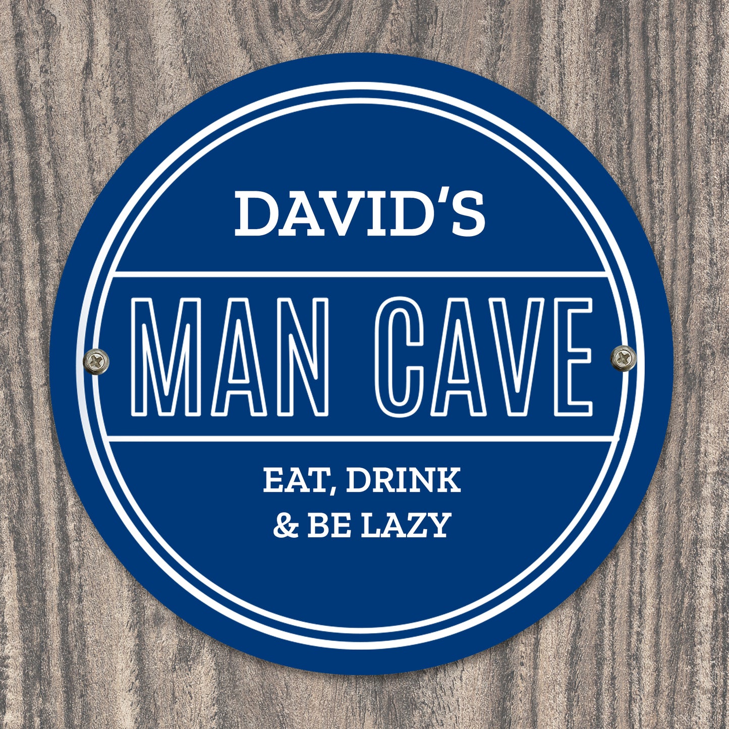 Personalised Circular blue sign with 'DAVID'S MAN CAVE EAT, DRINK & BE LAZY' text on a wooden background