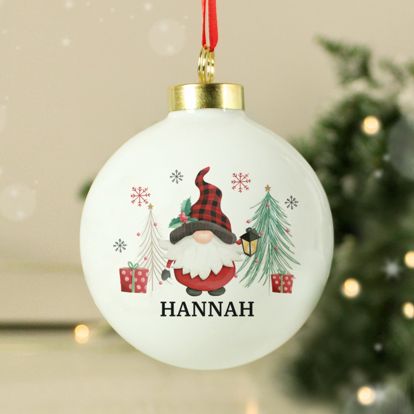 White hanging Christmas decoration with gnome, gift boxes, and trees, personalised with name and message