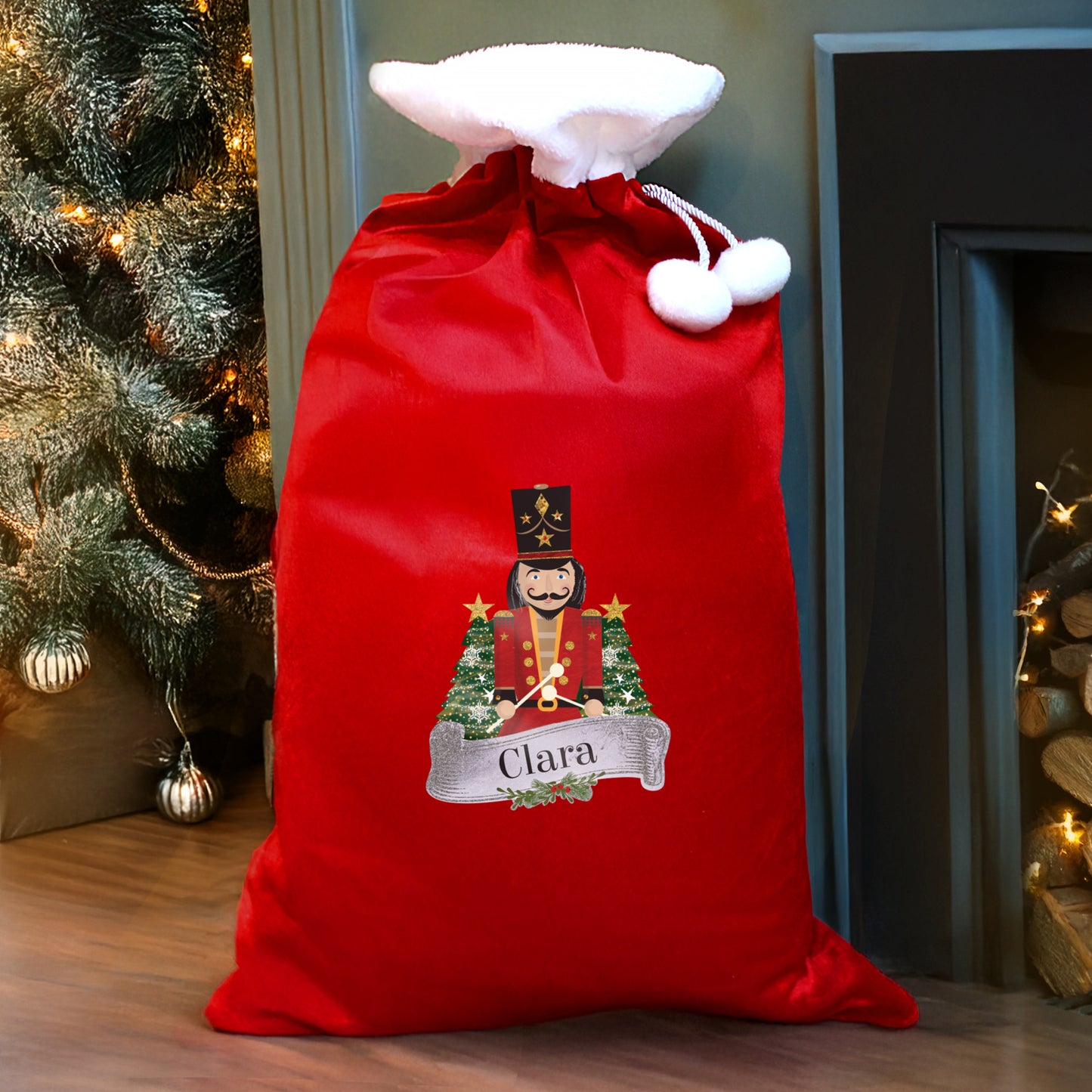 Red Christmas sack with a decorative design and name 'Clara' in a festive setting.