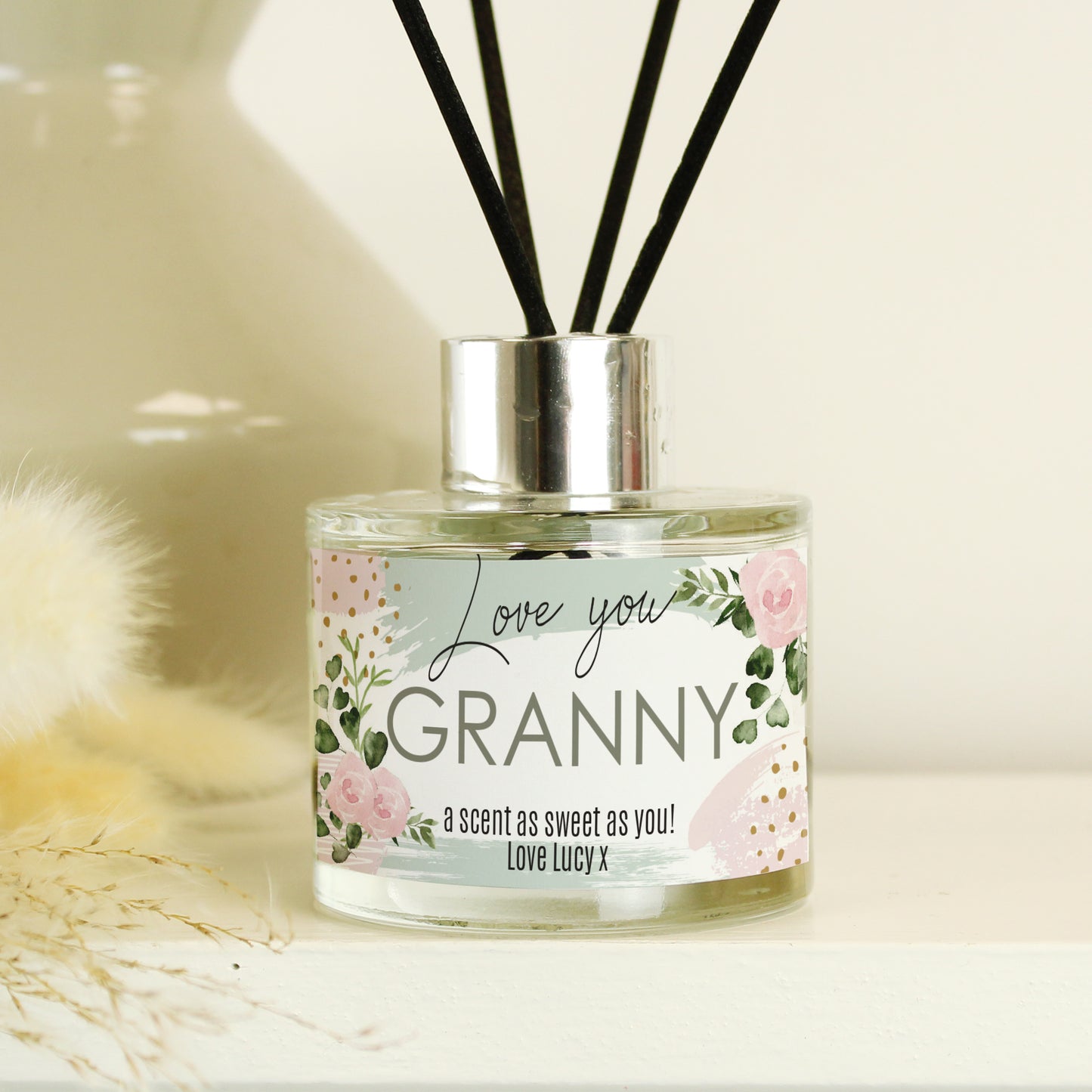 Diffuser bottle with 'Love you Granny' label on a light background