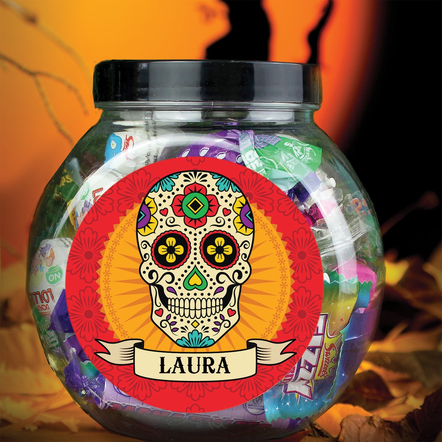 Jar of colorful candies with a sugar skull design and 'Laura' text on an orange background