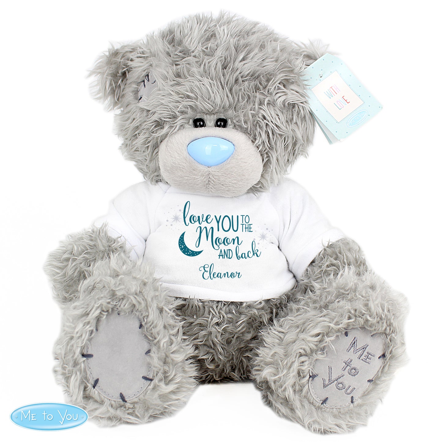 Grey teddy bear wearing a white shirt with text, on a white background