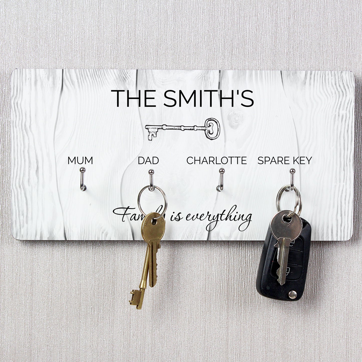 Key holder with keys attached, featuring 'The Smith's' and family-themed text on a white background.
