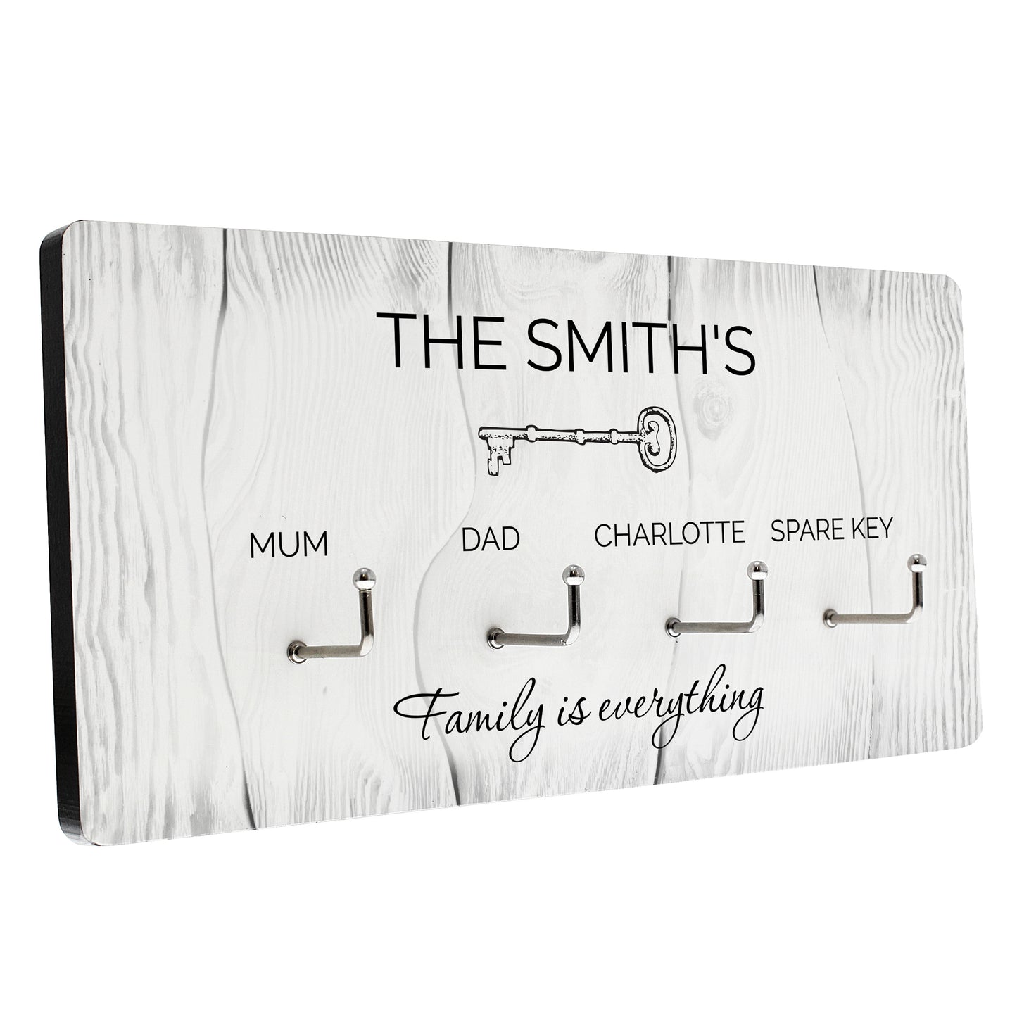 Key holder with hooks for keys, labeled 'The Smith's' and 'Family is everything', on a white background.