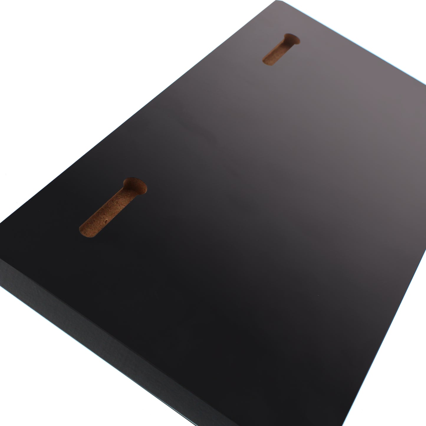 The back of the key holder. Black rectangular object with two brown slots on a white background