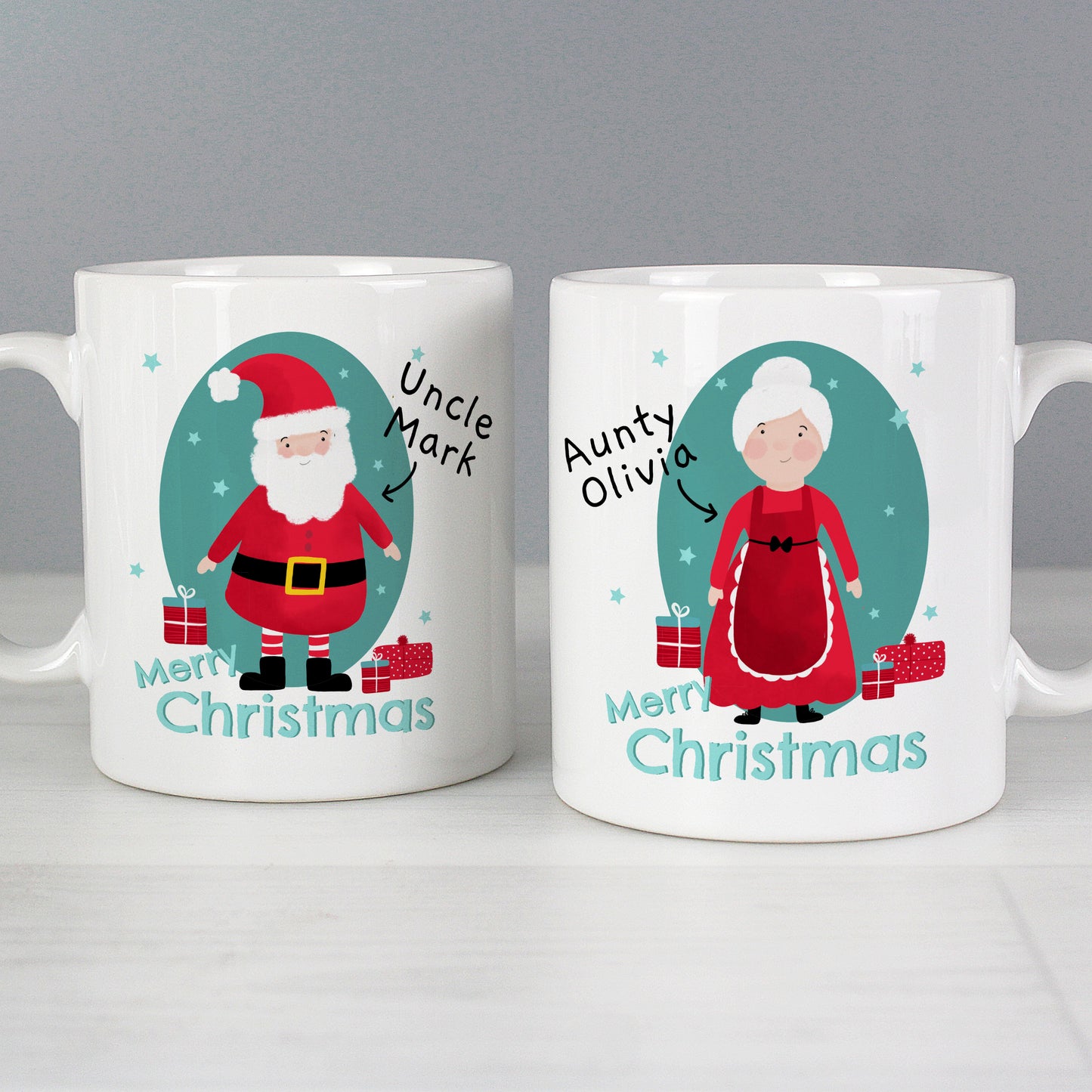 Two Christmas-themed mugs with illustrations of a man and a woman, labeled 'Uncle Mark' and 'Auntie Olivia', respectively.