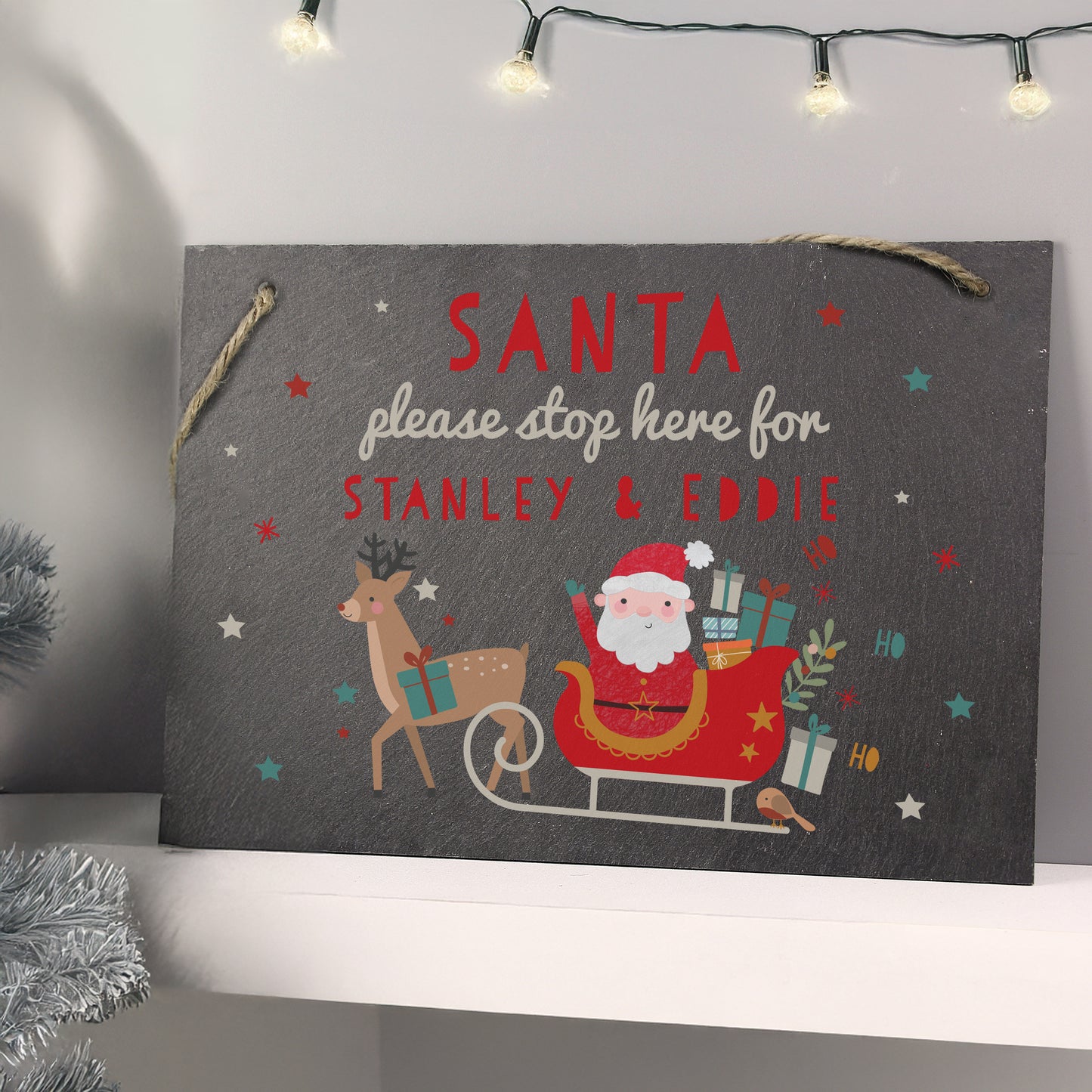 Decorative sign with Santa Claus and reindeer design, personalised for 'Stanley & Eddie'.