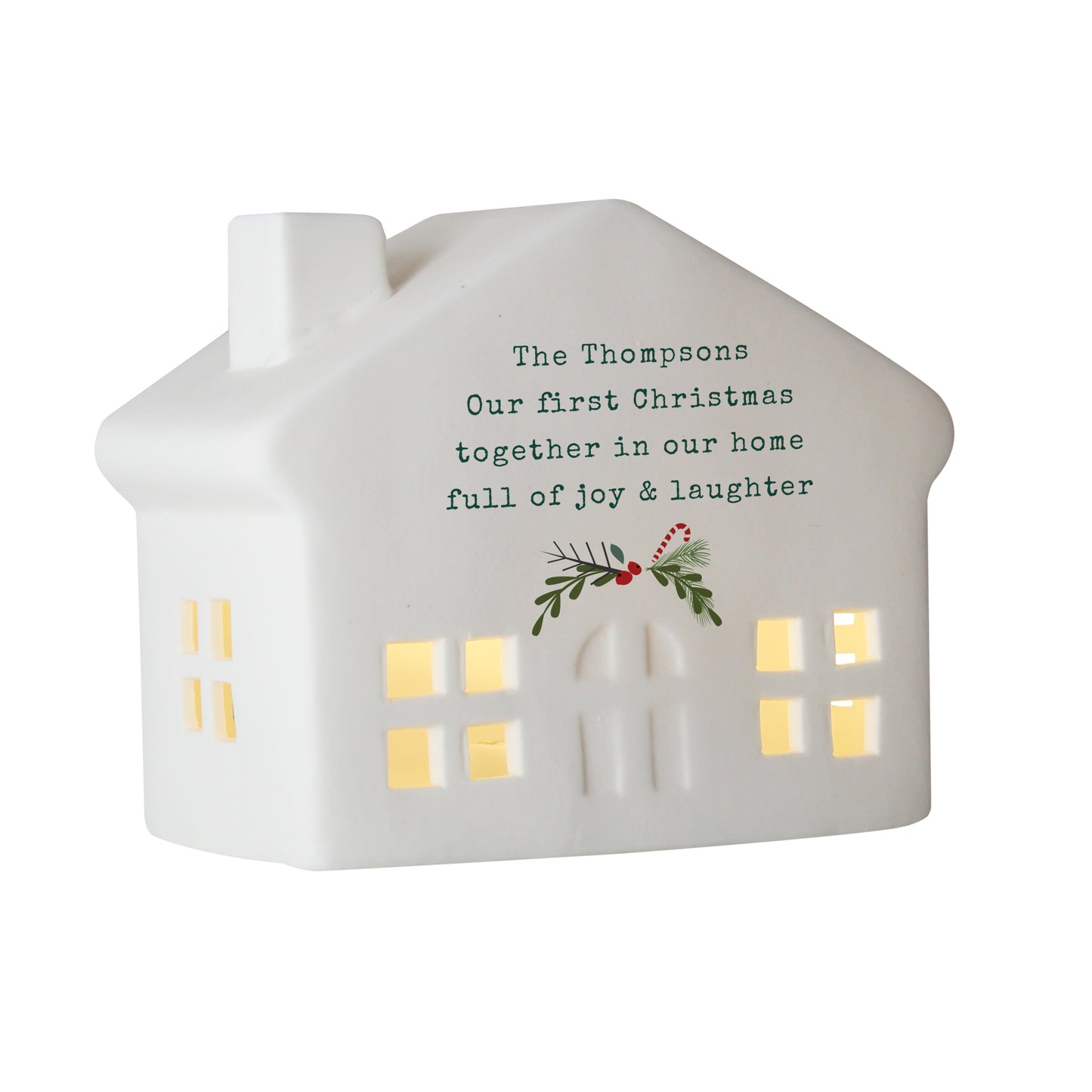 White house-shaped ornament with personalised text and lights on a white background