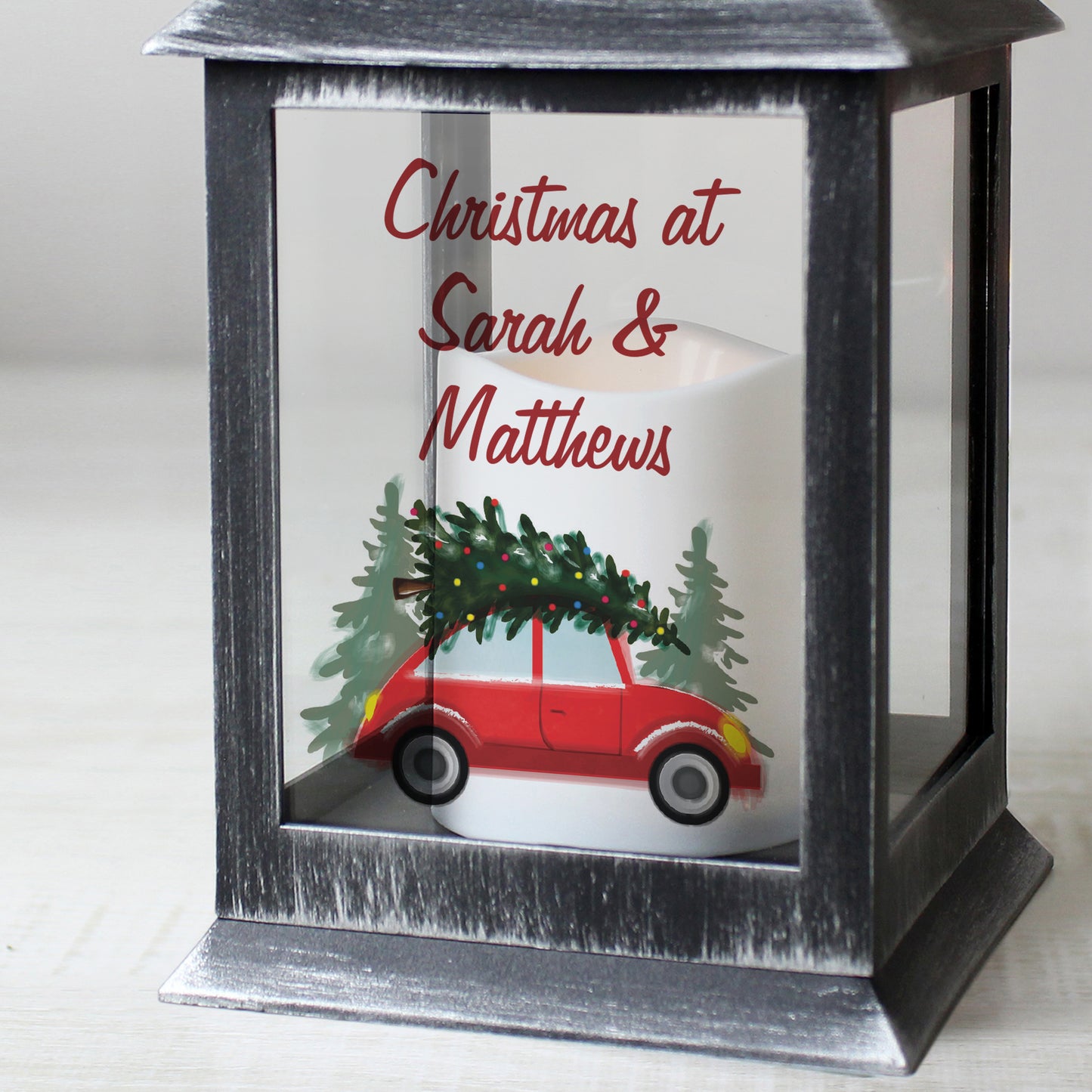 Decorative lantern with a Christmas scene and personalised text on a white background