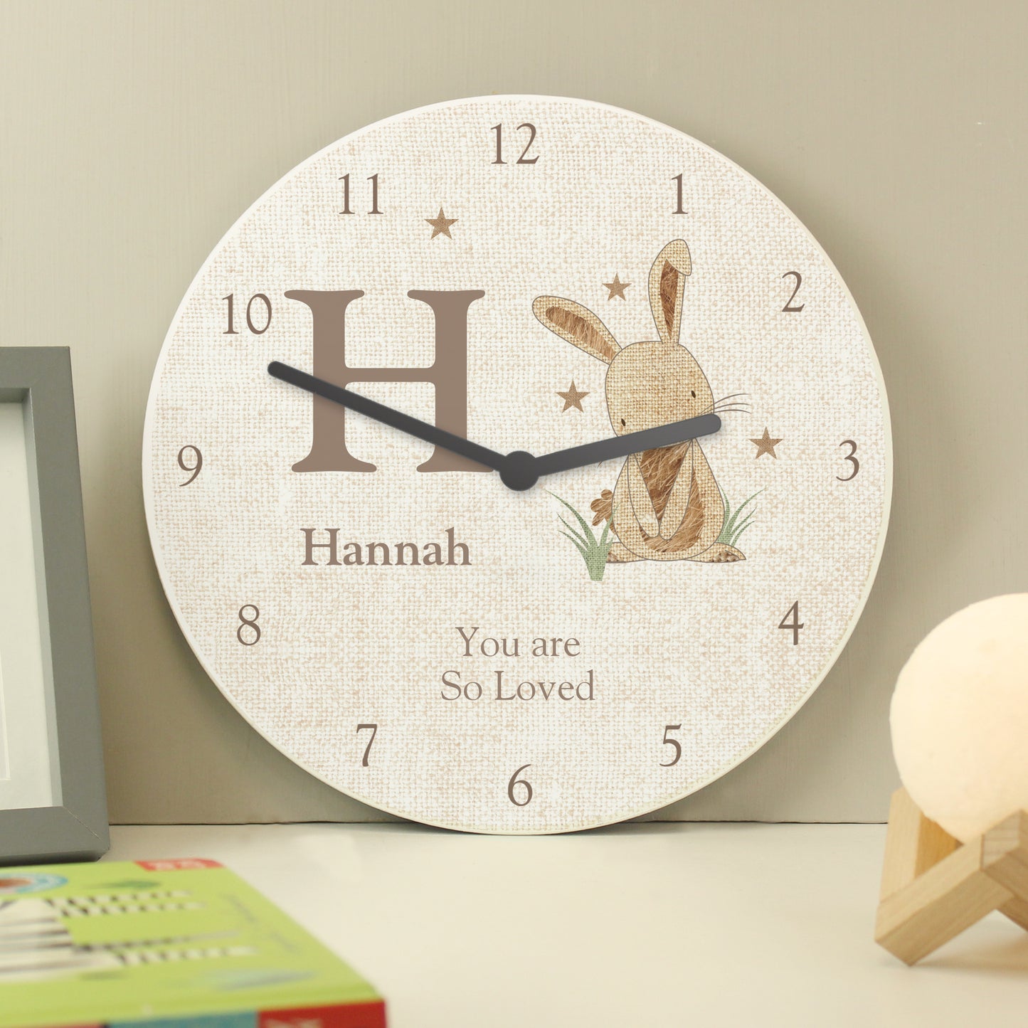 Personalised Wall clock with a rabbit illustration and text on a neutral background