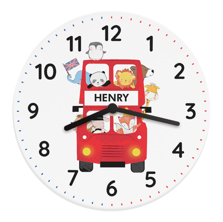 Children's wall clock with a red bus design and animal illustrations on a white background.