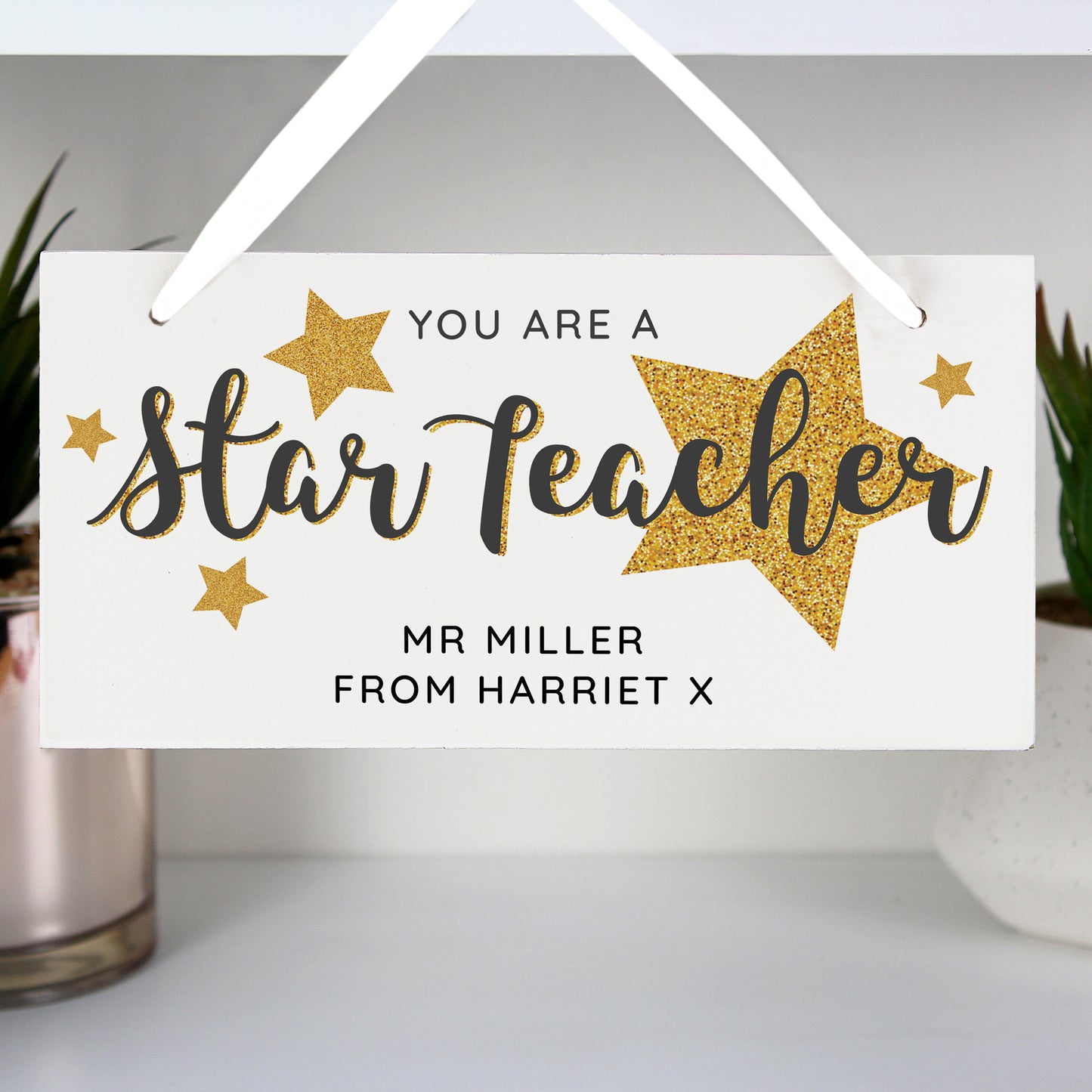 Decorative sign with 'You are a star teacher' text and gold stars on a white background.