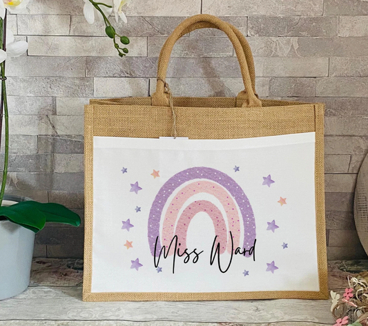 Personalised jute teacher tote bag with pink and purple rainbow design, surrounded by pastel stars, with custom name printed on the front