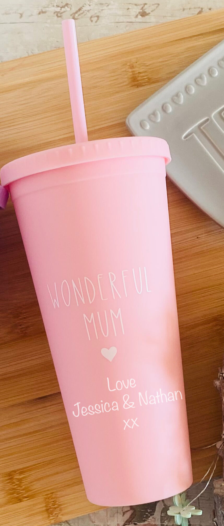Pink personalised cold cup with straw, featuring 'Wonderful Mum' message and custom text from children, perfect for gifting on Mother's Day