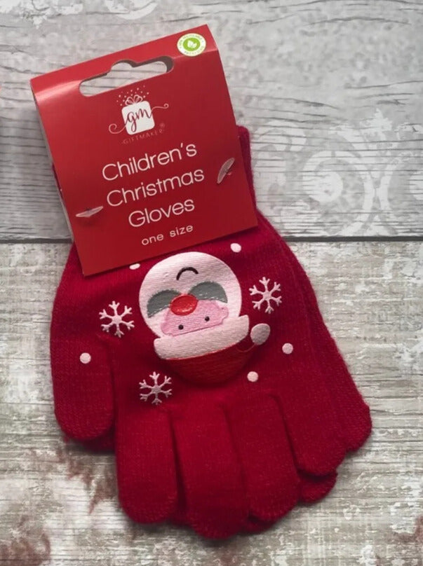 Red children's gloves featuring a smiling Santa Claus face and snowflake accents, packaged with a red Christmas label