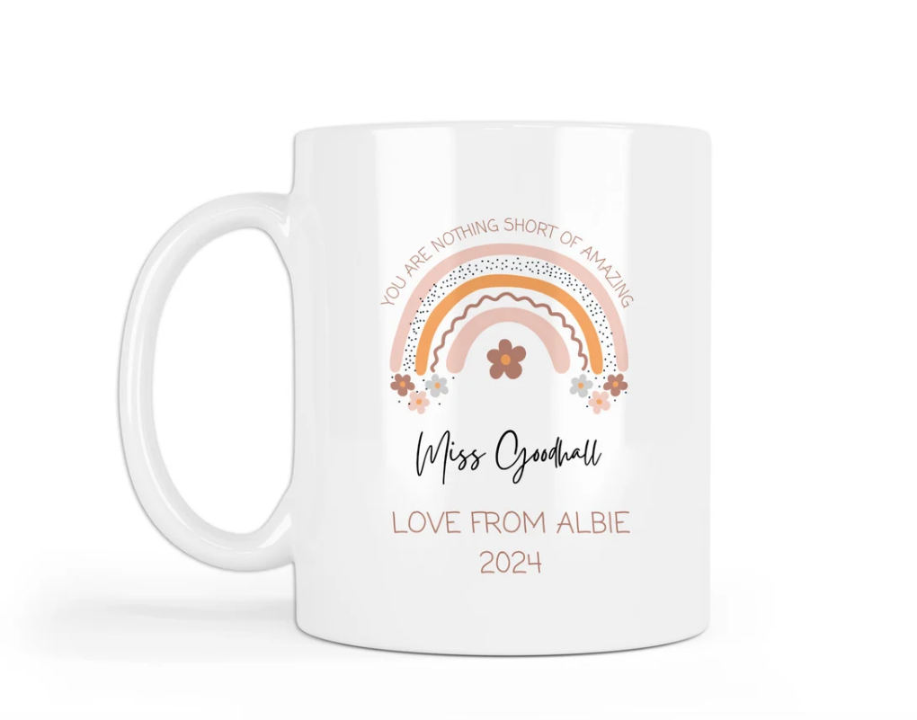 Custom white ceramic mug with pastel rainbow and floral artwork. Features the heartfelt message “You are nothing short of amazing,” personalised with “Miss Goodhall – Love from Albie 2024.” Ideal end-of-term gift for teachers or teaching assistants.