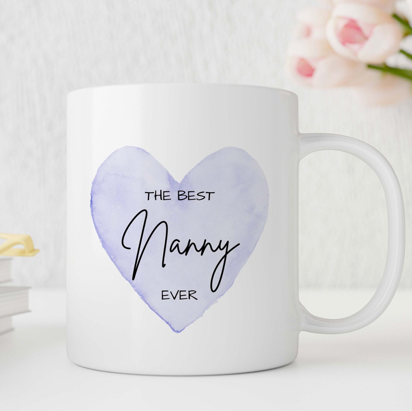Unique personalised nanny mug featuring a soft purple heart with “The Best Nanny Ever” text – a heartfelt gift idea for a special grandmother.
