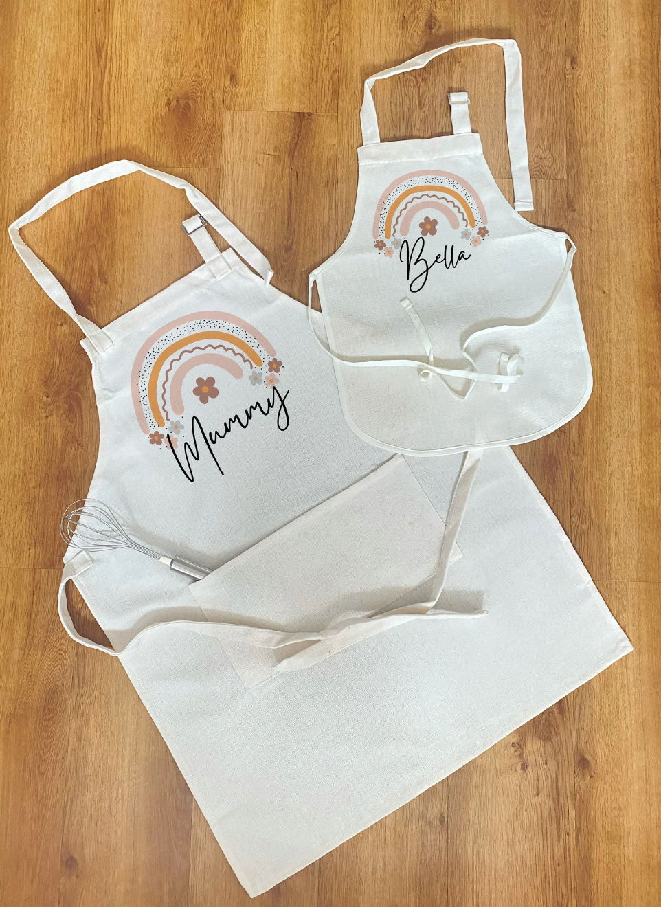 Personalised mummy and me apron set with custom names and boho rainbow design – a unique gift idea for families who love baking together.