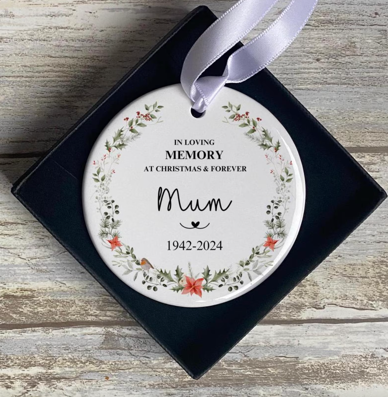 In loving memory Christmas ornament for Mum, personalised with name and dates. Ceramic round bauble with robin, holly and wreath design. Thoughtful remembrance gift or keepsake for those missing a loved one in 2024.