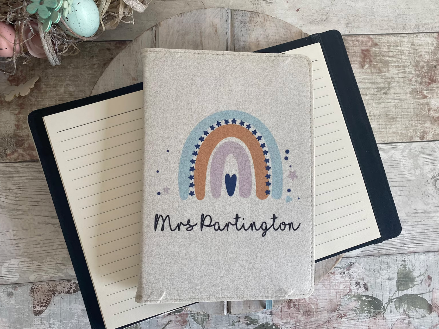 Personalised teacher notebook with rainbow design and name Mrs Partington in script font, custom linen journal for end of term gift, back to school stationery idea