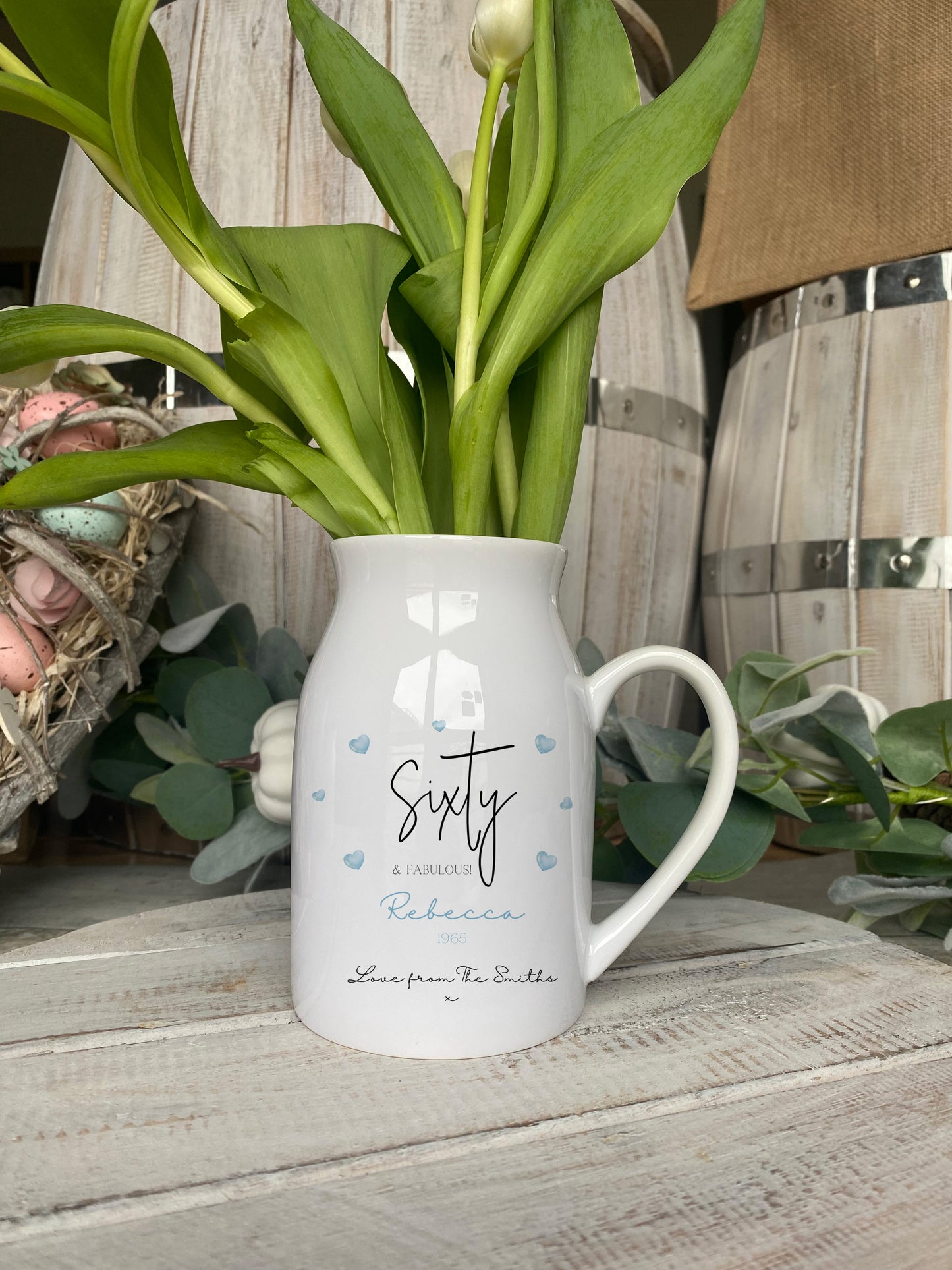 Custom birthday gift ceramic vase with 'Sixty & Fabulous' text, blue heart decorations, and personalised name and message