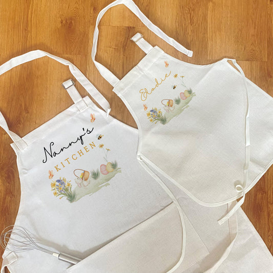 Matching personalised Easter aprons for adult and child with spring design, custom names, and bunny and egg illustrations