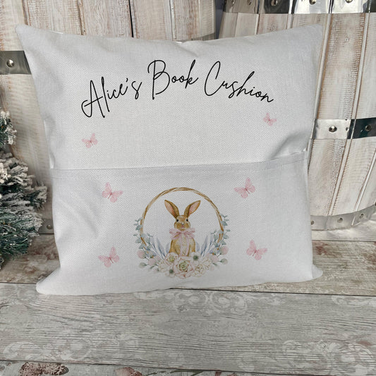 Unique personalised children’s book cushion featuring “Alice’s Book Cushion” text with a sweet bunny and floral wreath design – a thoughtful Easter gift idea.