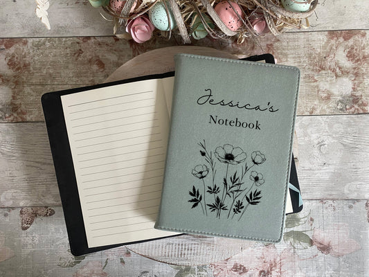 Custom floral notebook with soft sage green cover, featuring hand-drawn poppy flowers and 'Jessica’s Notebook' in cursive