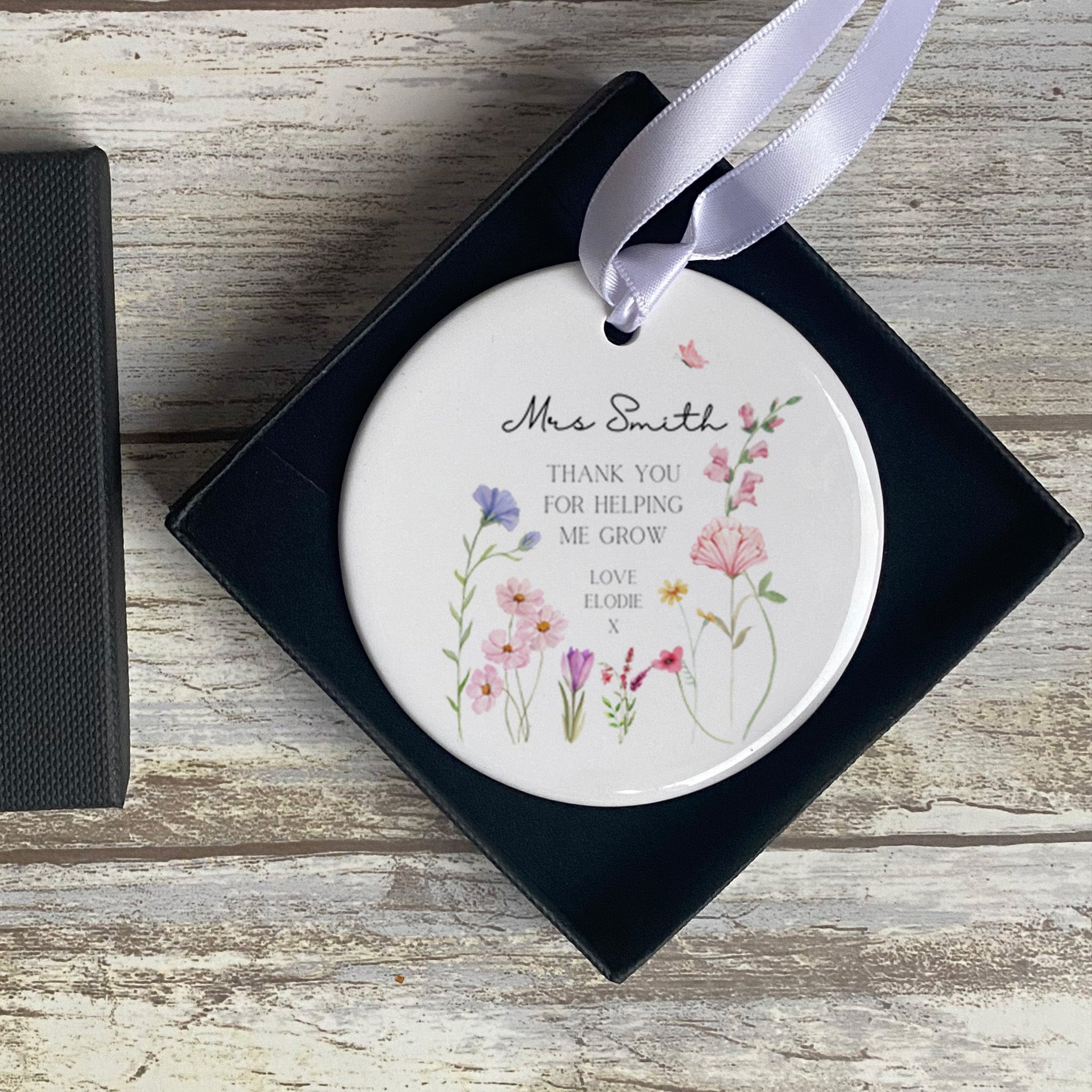 Personalised Teacher Ornament with ribbon and gift box. Featuring the saying 'Thank you for helping me grow' and personalised with the Teacher's name and who it's from.