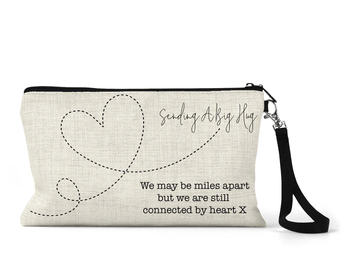 Pouch with heart design and text on a white background