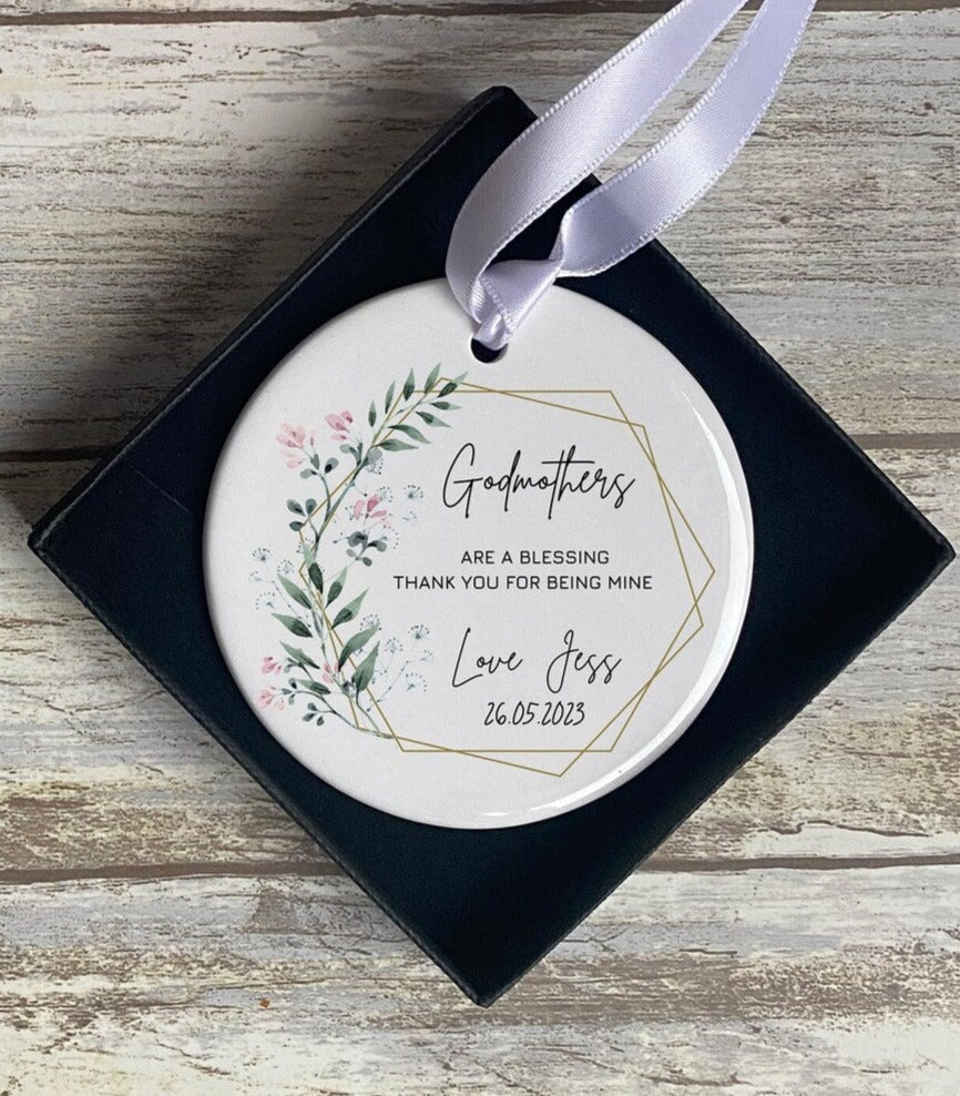 A version addressed to “Godmothers” in identical format and style, inside the gift box with ribbon and floral accent.