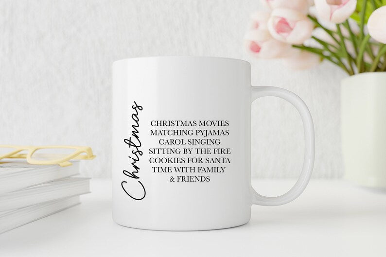 White mug with Christmas-themed text on a light background