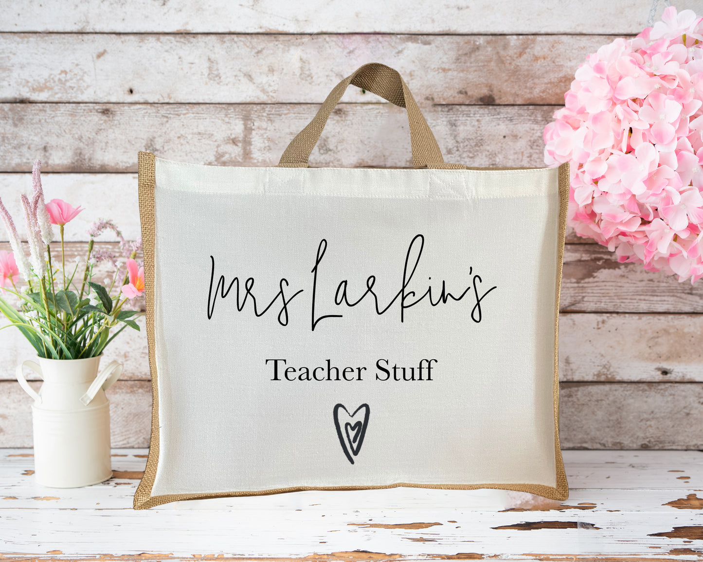 Personalised jute teacher tote bag with “Mrs Larkin’s Teacher Stuff” printed in script font and heart detail, a thoughtful teacher appreciation gift.