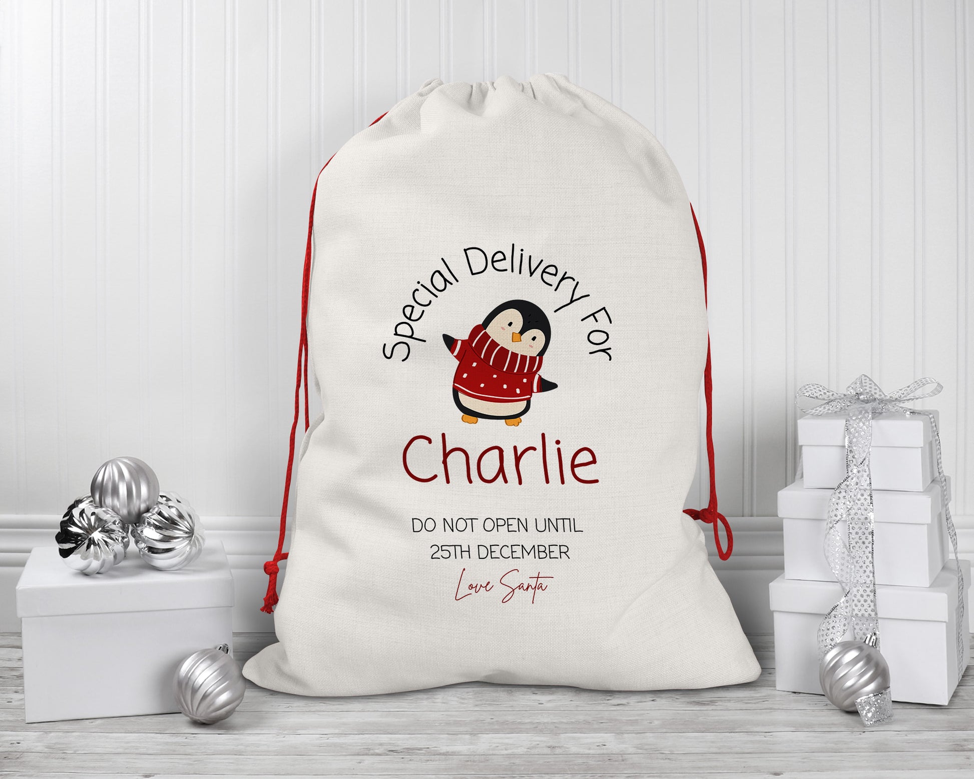 Personalised Christmas gift sack with cute penguin design – custom linen Santa sack for kids with red drawstring – “Special Delivery for Charlie” print